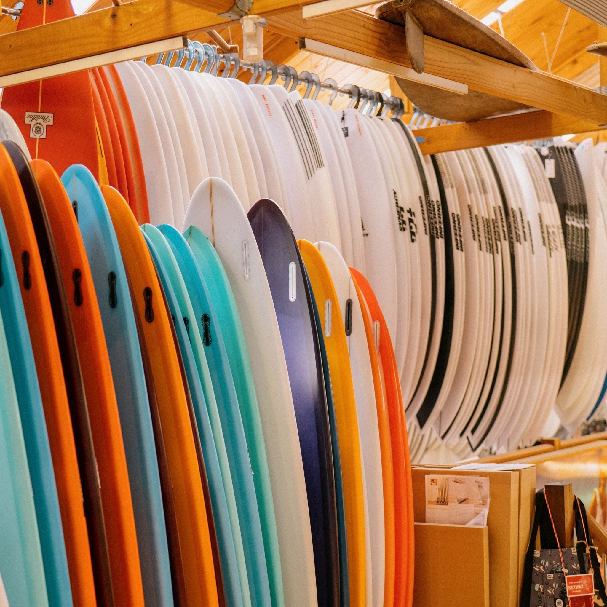 coloured mid length surfboards